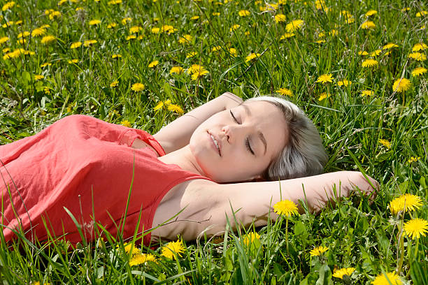 istock woman on flower meadow 525033190