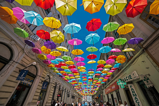 Timisoara, Romania - April 22, 2016: Street with colored umbrellas in Timisoara, Romania