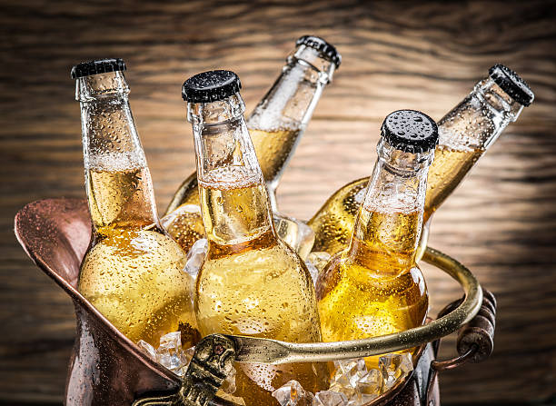 istock Cold bottles of beer in the brazen bucket. 525035014