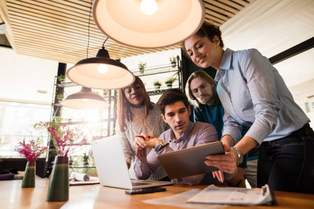 istock Below view of business people using digital tablet on meeting. 525035200