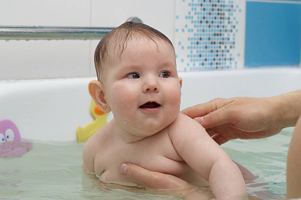 istock Newborn baby bathe and swim 525035308