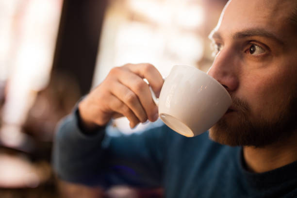 istock Close-up of a man drinking coffee. 525037384