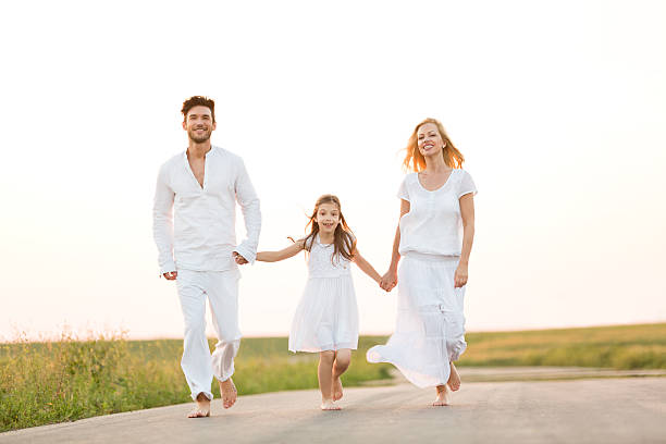 istock Happy Family Walking Down The Road 525039051