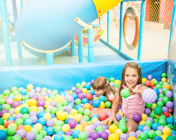 istock Girls in ball pool 525039280