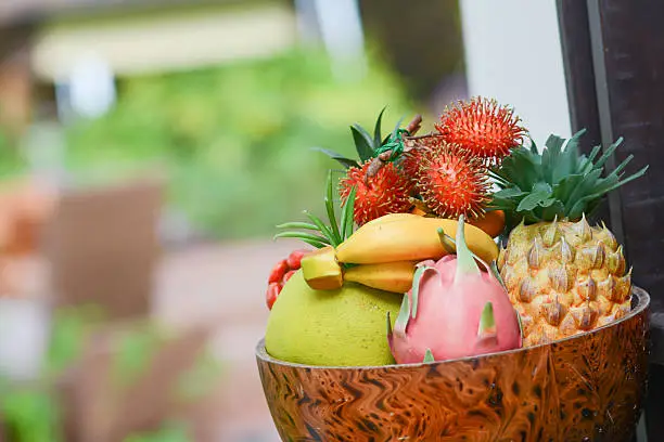 lot of fruits in wood bowl, plastic