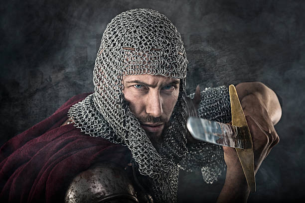 istock Medieval Warrior with chain mail armour and sword 525040126