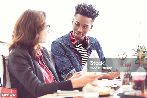 Designers At Work Stock Photo - Download Image Now - Cheerful, Colleague, Desk