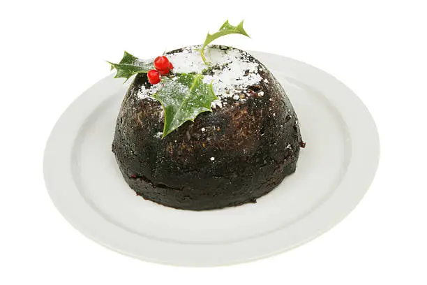 Decorated Christmas pudding on a plate