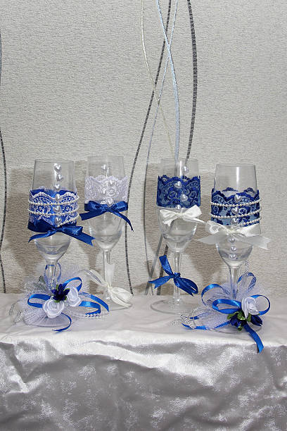 istock Two glasses decorated with flowers for a wedding reception 525041116