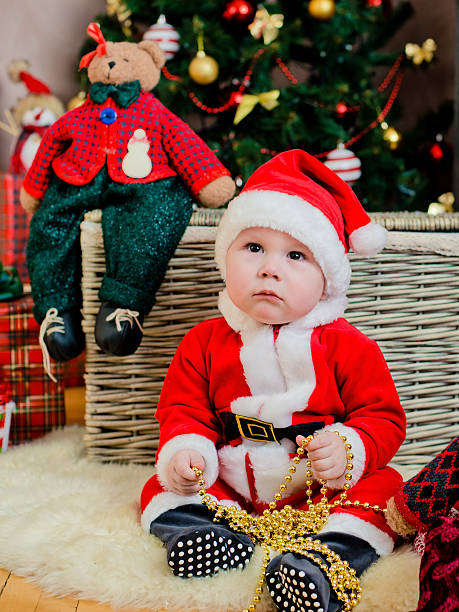 istock toddler sitting in a Christmas interior 525041555