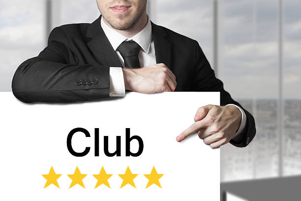 istock businessman pointing on sign club 525041607