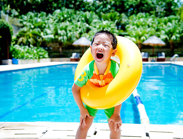 istock boy with swimming tube 525042079