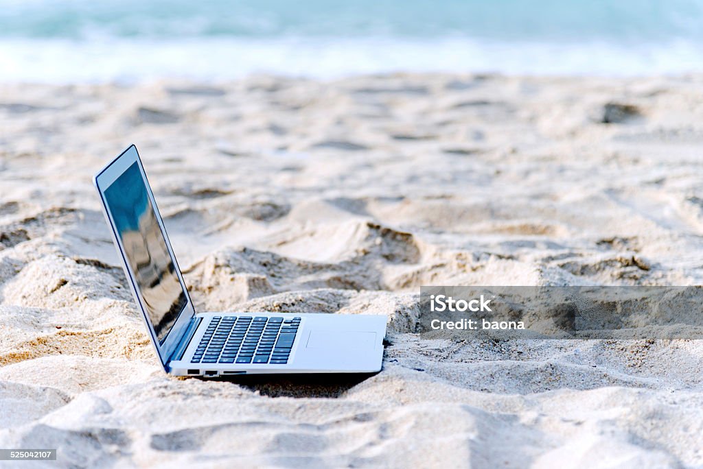 laptop on beach laptop on a tropical beach Beach Stock Photo