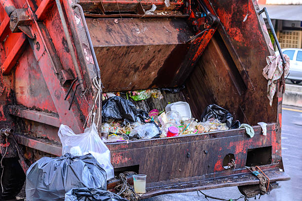 istock Garbage truck keeping garbage on urban street. 525043042