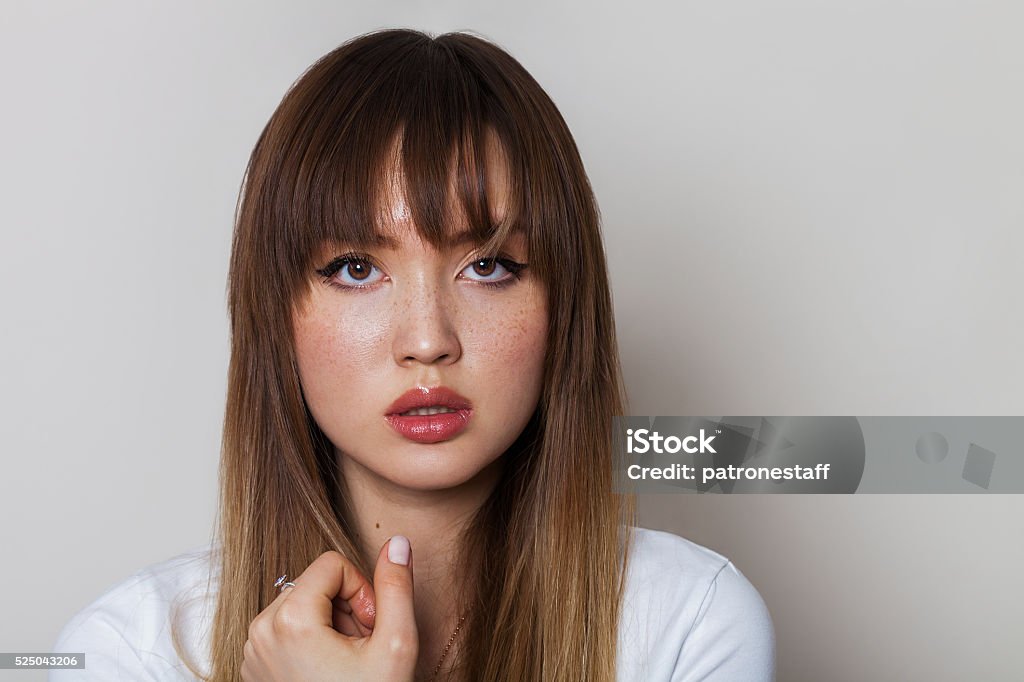 Beautiful girl with freckles Bangs - Hair Stock Photo