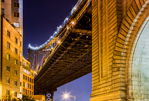 Night views of New York City. Brooklyn Bridge.