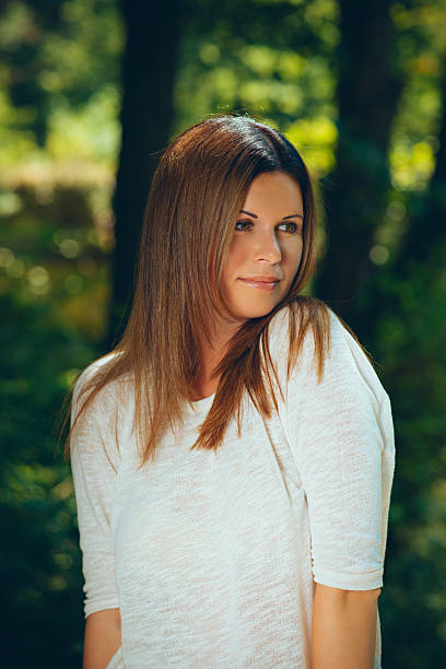 istock woman among green trees 525063739