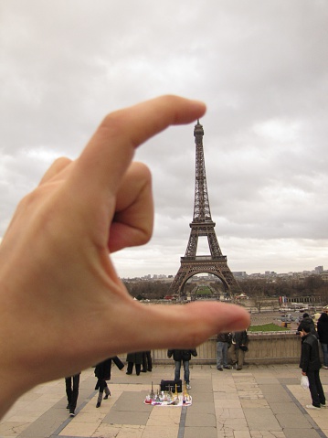 Paris, France, january 6 2012, eiffel tower in autumn, the world is in your hands, the sky is the limit