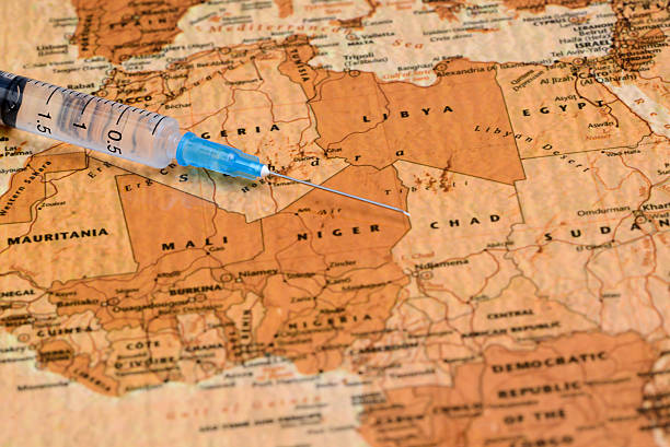 istock syringe on a map of africa 525073813