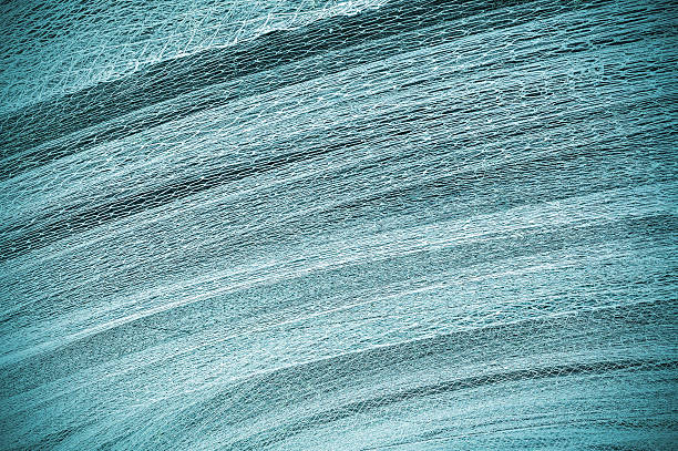 abstrack fondo hecho de una red de pesca. - commercial fishing net netting fishing striped fotografías e imágenes de stock