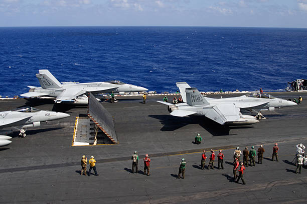 Fighter Planes preparing to launch from USS Nimitz Aircraft Carrier stock photo