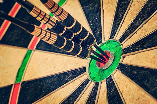 istock Three darts in bull's eye close up 525075871