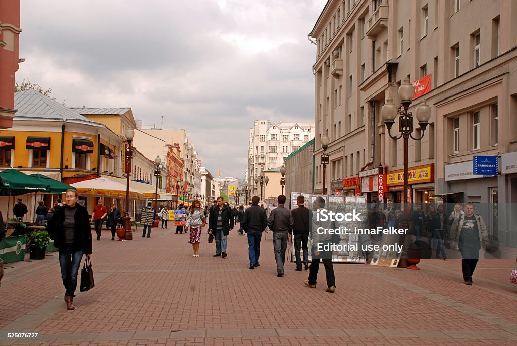 Arbat Street in Moscow,Russia Moscow, Russia - May 15, 2011: Locals and tourists walking on the famous pedestrian Arbat Street in Moscow,Russia. Street artists are showing and selling their pictures to the tourists on the street market. Architecture Stock Photo