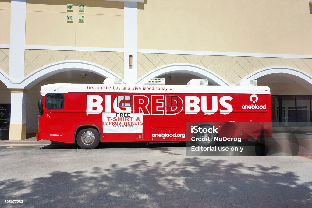 Big Red Bus blood donor bus West Palm Beach, USA - October 2, 2014: A Big Red Bus blood donor bus is parked in a suburban strip mall parking lot. The bus is operated by One Blood, a not for profit community organization dedicated to provide safe, affordable blood to area hospitals and their patients. Blood Donation Stock Photo