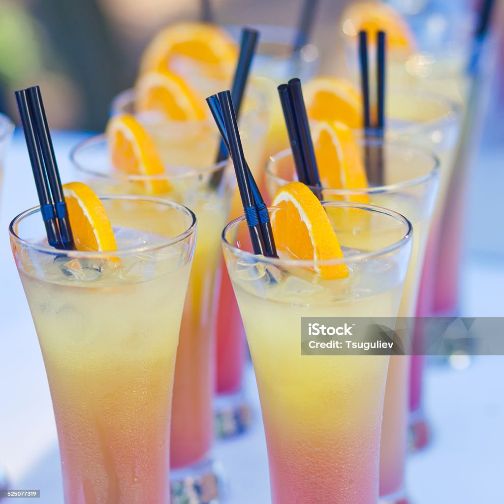 line of different coloured alcohol cocktails on a open-air party outdoor, pouring, decoration, bar, white, liquid, corporate, row, decorated, beverage, drink, vodka, buffet, line, shot, night, bartender, restaurant, celebration, summer, setting, event, alcohol, open, people, wine, partying, ready, banquet, daiquiri, cocktail, bottle, lifestyle, young, nightclub, catering, liquor, menu, martini, barman, splash, happy, air, nightlife, glass, mixed	outdoor, pouring, decoration, bar, white, liquid, corporate, row, decorated, beverage, drink, vodka, buffet, line, shot, night, bartender, restaurant, celebration, summer, setting, event, alcohol, open, people, wine, partying, ready, banquet, daiquiri, cocktail, bottle, lifestyle, young, nightclub, catering, liquor, menu, martini, barman, splash, happy, air, nightlife, glass, mixed	Beautiful line of glasses and shots with different colored cocktails with on a open air corporate or birthday party, tequila, martini, vodka, and others on decorated catering bouquet table Bartender Stock Photo