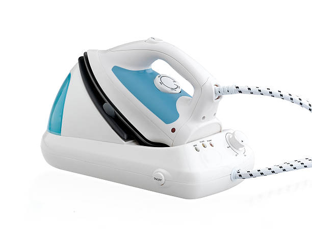 istock Steam iron with base the laundry machine isolated 525078035