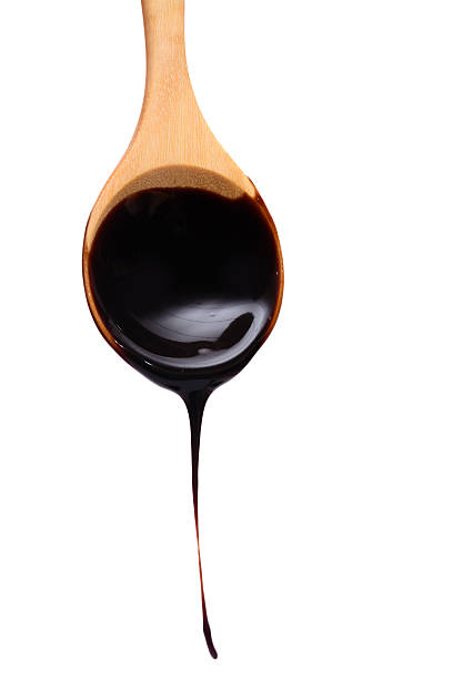 istock Wooden spoon and chocolate fudge 525078423