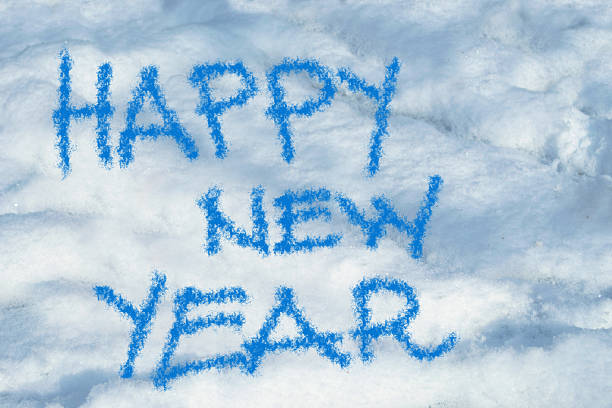 istock happy new year written in the snow 525078791