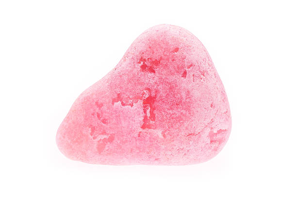 istock Rough pink rose quartz spots isolated 525105061