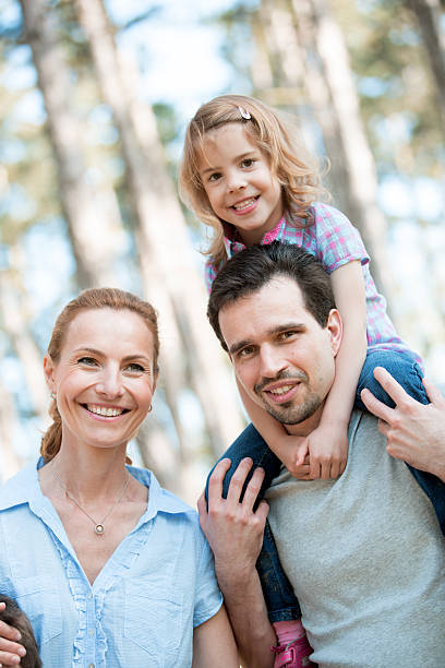 istock happy family taking a walk in forest 525119683