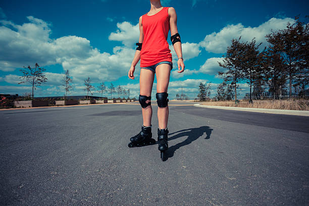 istock Young woman rollerblading on sunny day 525119893
