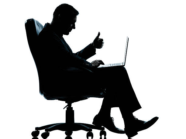 istock one business man computer computing thumb up sitting in armchair 525120007