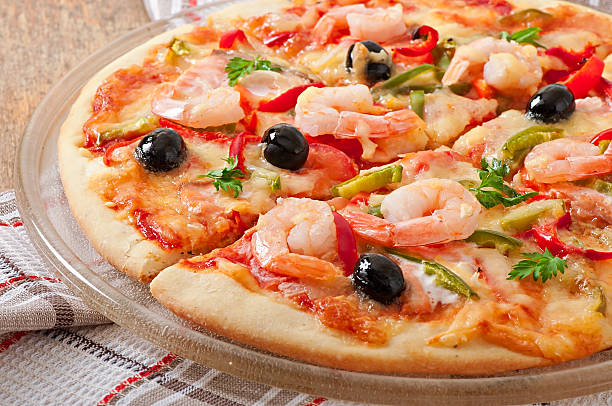 istock Pizza with shrimp, salmon and olives 525120415