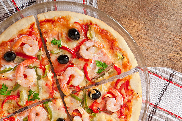 istock Pizza with shrimp, salmon and olives 525120421