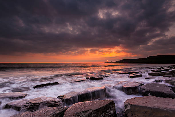 istock Rocky Dorset Coastline at sunset 525122199