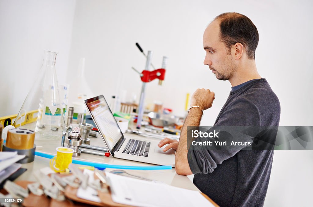 Brewing is a science Shot of a man working on a laptop while surrounded with brewing equipmenthttp://195.154.178.81/DATA/i_collage/pi/shoots/784464.jpg Fermenting Stock Photo