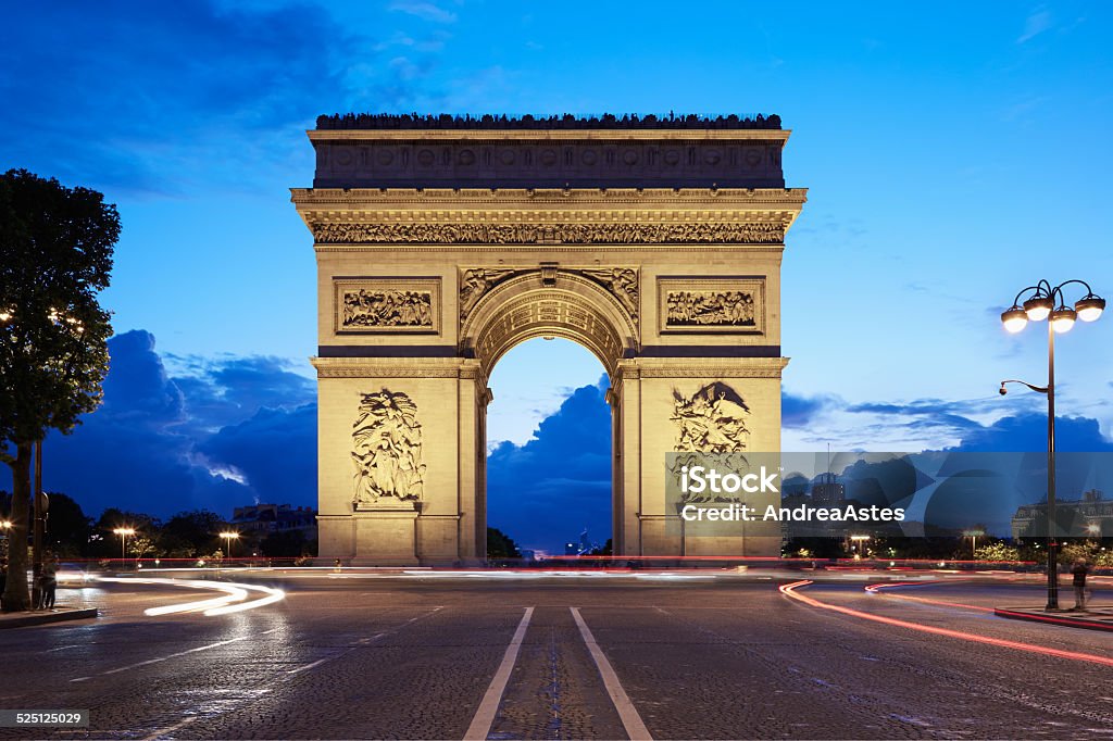 Arc de Triomphe in Paris at night from Champs Elysees Arc de Triomphe in Paris at night seen from Champs Elysees, France Arc de Triomphe - Paris Stock Photo