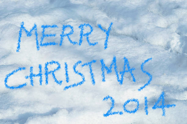 istock merry christmas 2014 written in the snow 525125265