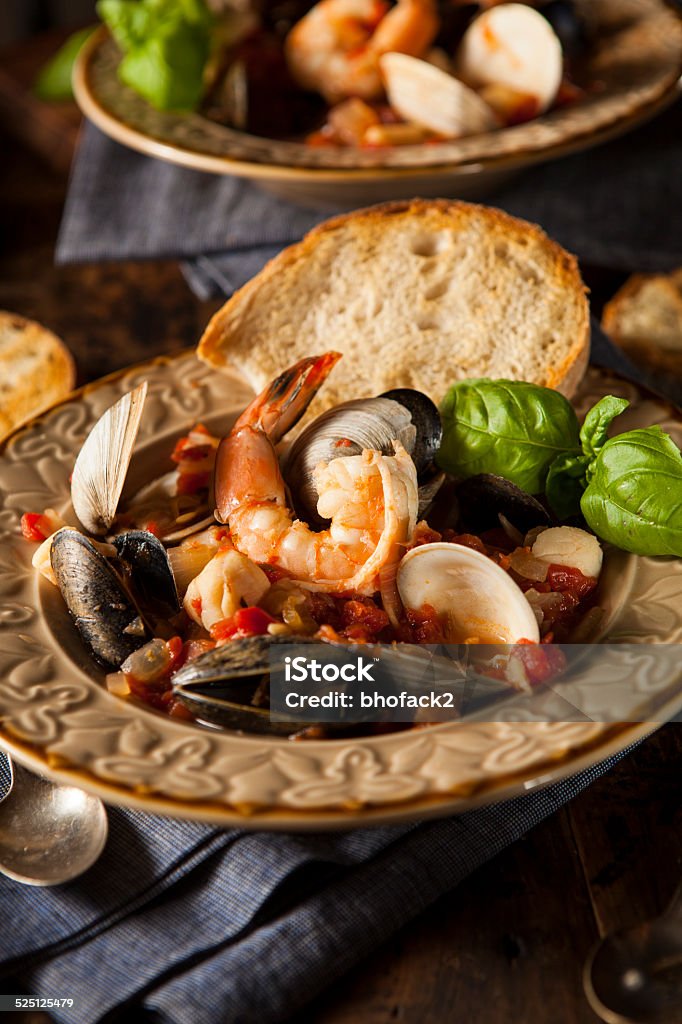 Homemade Italian Seafood Cioppino Homemade Italian Seafood Cioppino with Mussels, Clams, and Shrimps Bowl Stock Photo