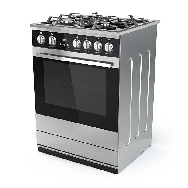 Stainless steel gas cooker with oven isolated on white. stock photo