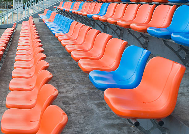 istock orange and blue grandstand chairs 525126471