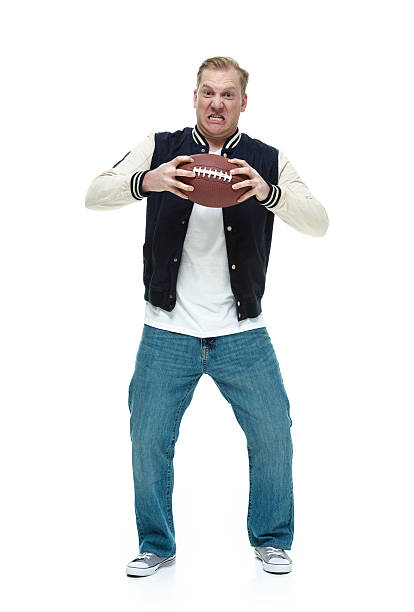 istock Angry college student holding a football 525127227