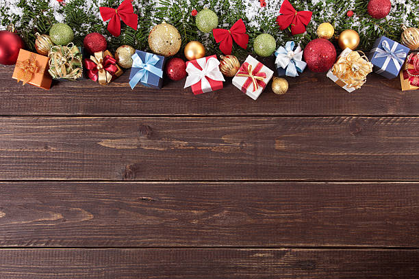 istock Christmas decorations on wooden board background with copy space 525139465