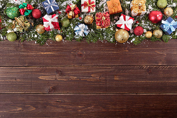 istock Christmas decorations on wooden board background with copy space 525139479