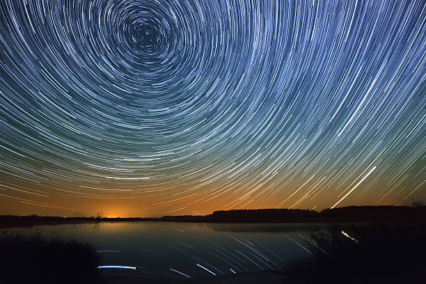 istock Smooth surface of the lake on a background  starry sky 525139777