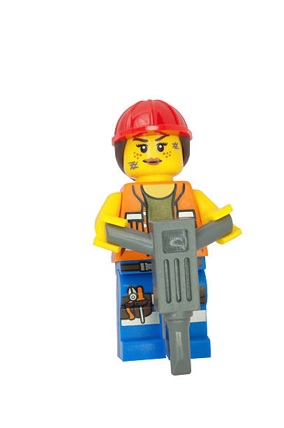 Tambov, Russian Federation - February 10, 2014: LEGO Hard Hat Emmet minifigure on black background. LEGO Movie series. Studio shot.